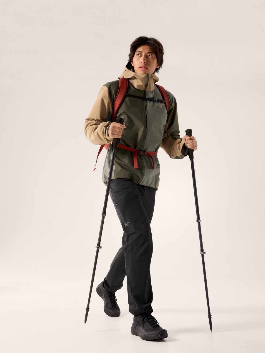 Arc'teryx Beta Jacket Men's in Forage-Tatsu-Canvas colorway with hiking poles and backpack